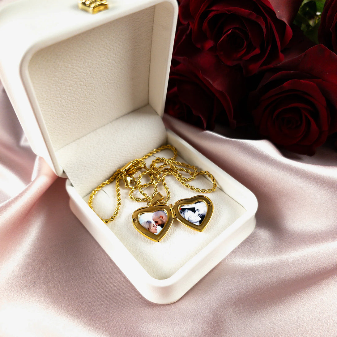 Personalized gold heart locket with photo in white box, romantic gift on pink satin with red roses